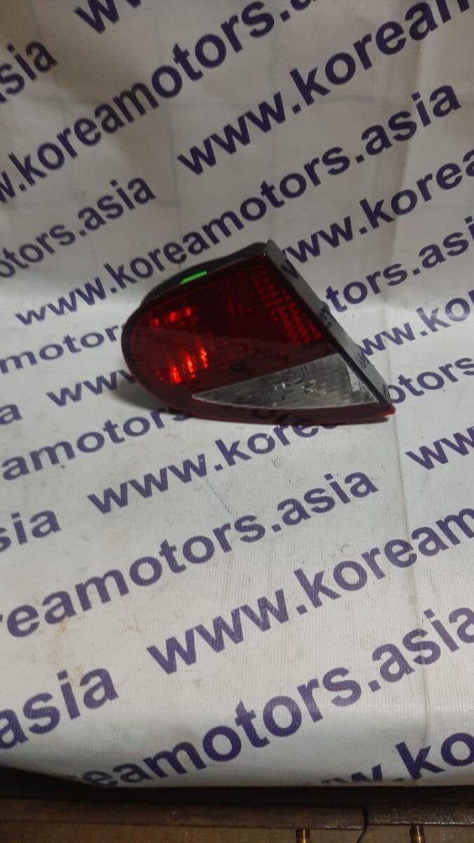 Фонарь задний Daewoo Sens (в крышке багажника, левый) Фонарь задний Daewoo Sens (в крышке багажника, левый)