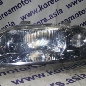 Фара передняя Chevrolet Aveo (левая)  (мех. корректор)