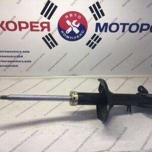 Стойка амортизатора задняя Kia Spectra (левая)